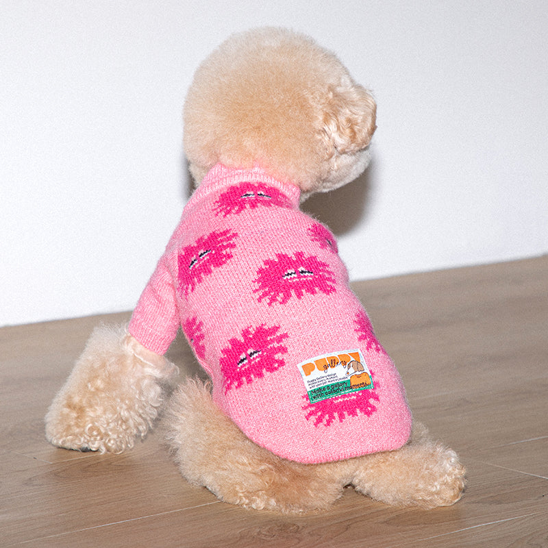 poodle is wearing anemone knit sweater in pink color